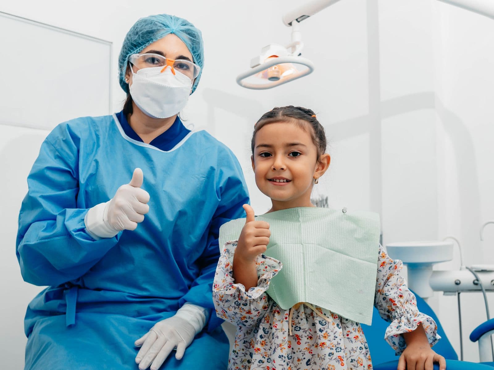 A friendly dentist and a happy young patient at Fairfield Dental Centre